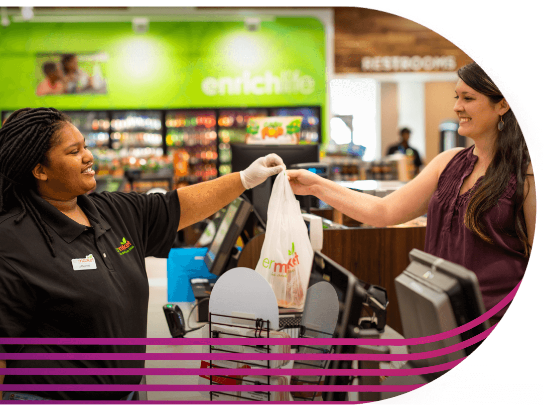 Convenience Store cashier and customer with bag