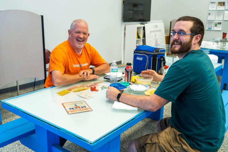 Vivid coworkers eating lunch
